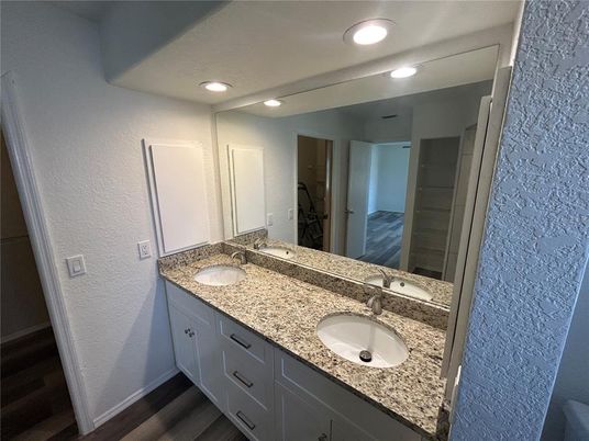 Bathroom, Dual Sink Vanities, Interior, Recessed Lighting, Wood Texture Flooring