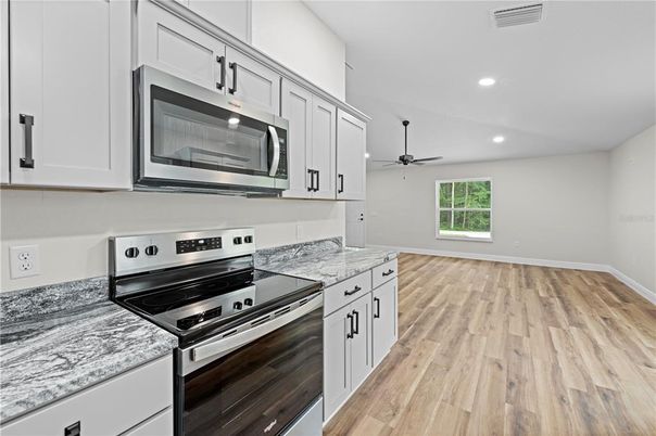 Interior, Kitchen, Recessed Lighting, Stainless Steel Appliances, Wood Texture Flooring