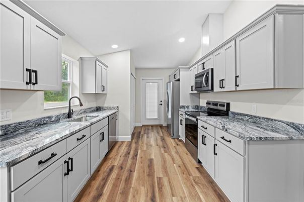 Interior, Kitchen, Recessed Lighting, Stainless Steel Appliances, Wood Texture Flooring