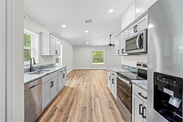 Interior, Kitchen, Recessed Lighting, Stainless Steel Appliances, Wood Texture Flooring