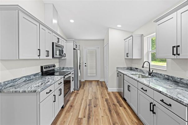 Interior, Kitchen, Recessed Lighting, Stainless Steel Appliances, Wood Texture Flooring