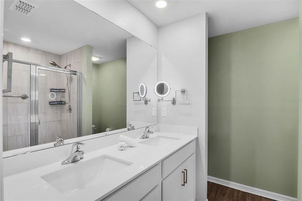 Bathroom, Dual Sink Vanities, Glass Shower, Interior, Recessed Lighting, Wood Texture Flooring