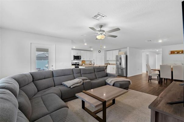 Dining room, Interior, Kitchen, Living room, Recessed Lighting, Stainless Steel Appliances, Wood Texture Flooring