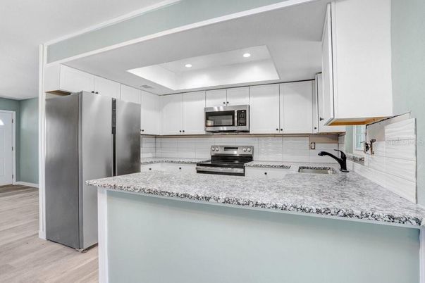 Interior, Kitchen, Recessed Lighting, Stainless Steel Appliances, Wood Texture Flooring