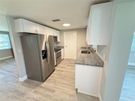 Interior, Kitchen, Recessed Lighting, Stainless Steel Appliances, Wood Texture Flooring