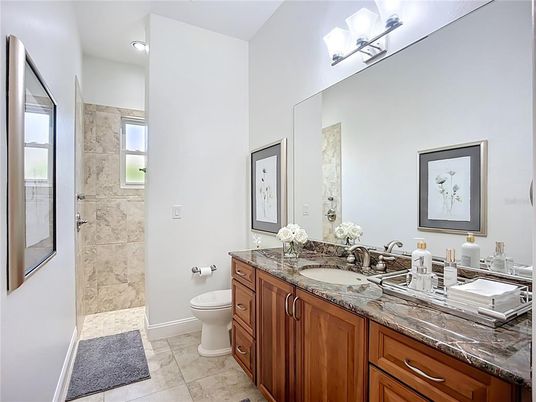 Bathroom, Dual Sink Vanities, Glass Shower, Interior, Marble Walls, Recessed Lighting