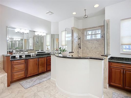 Bathroom, Dual Sink Vanities, Glass Shower, Interior, Marble, Marble Walls, Recessed Lighting