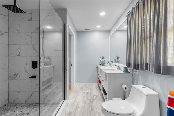 Bathroom, Dual Sink Vanities, Glass Shower, Interior, Marble Walls, Recessed Lighting
