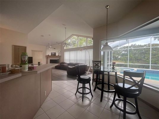 Dining room, Fireplace, Interior, Living room, Pendant Lights, Pool, Recessed Lighting, Sun Room
