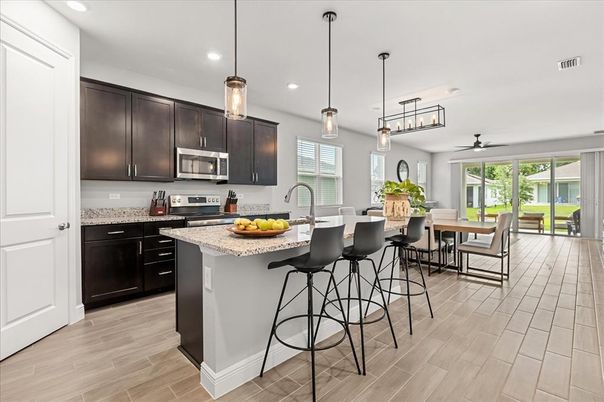 Dining room, Interior, Kitchen, Pendant Lights, Recessed Lighting, Stainless Steel Appliances, Wood Texture Flooring