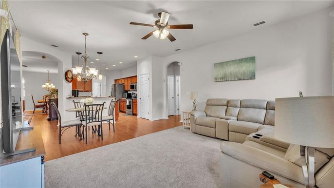 Chandelier, Dining room, Interior, Kitchen, Living room, Pendant Lights, Recessed Lighting, Stainless Steel Appliances, Wood Texture Flooring