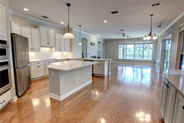Chandelier, Interior, Kitchen, Pendant Lights, Recessed Lighting, Stainless Steel Appliances, Wood Texture Flooring