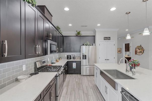 Dining room, Interior, Kitchen, Living room, Pendant Lights, Recessed Lighting, Stainless Steel Appliances, Wood Texture Flooring