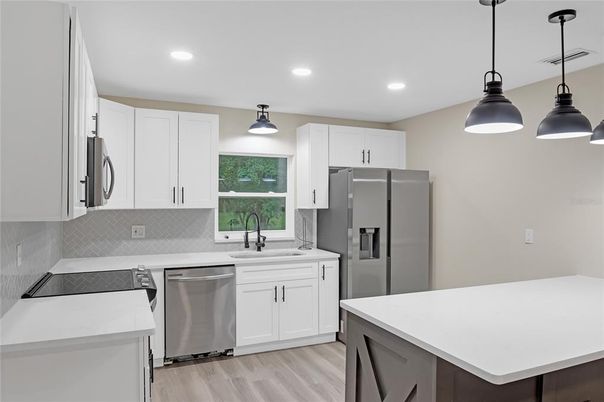 Interior, Kitchen, Pendant Lights, Recessed Lighting, Stainless Steel Appliances, Wood Texture Flooring