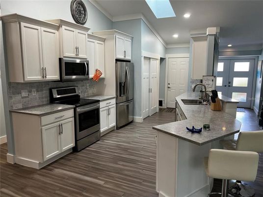 Interior, Kitchen, Recessed Lighting, Stainless Steel Appliances, Wood Texture Flooring