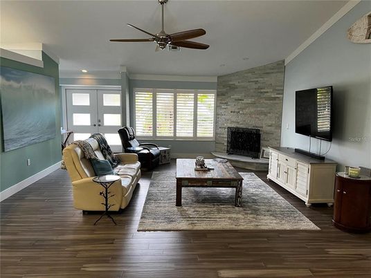 Fireplace, Interior, Living room, Recessed Lighting, Stone Walls, Wood Texture Flooring