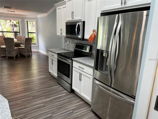 Dining room, Interior, Kitchen, Pendant Lights, Stainless Steel Appliances, Wood Texture Flooring