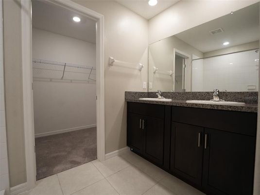 Bathroom, Dual Sink Vanities, Interior, Recessed Lighting, Walk-in Closets