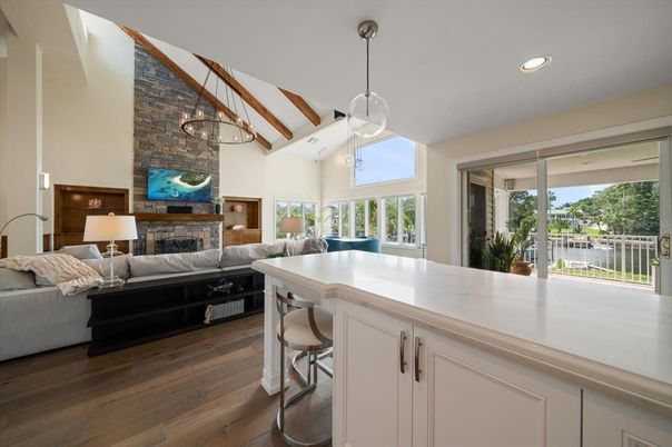 Fireplace, Interior, Living room, Pendant Lights, Recessed Lighting, Stone Walls, Wooden Beams, Wood Texture Flooring
