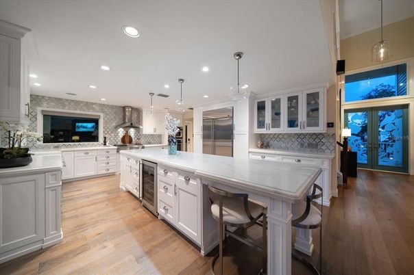 Interior, Kitchen, Pendant Lights, Recessed Lighting, Stainless Steel Appliances, Stone Walls, Wood Texture Flooring