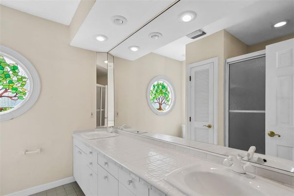 Bathroom, Dual Sink Vanities, Interior, Recessed Lighting, Tile Countertops
