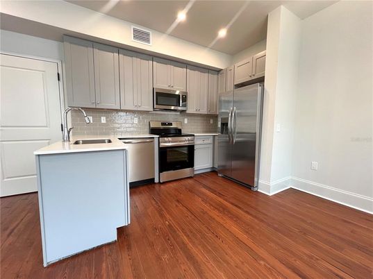 Interior, Kitchen, Recessed Lighting, Stainless Steel Appliances, Wood Texture Flooring