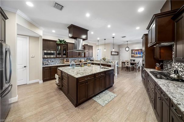 Dining room, Interior, Kitchen, Pendant Lights, Recessed Lighting, Stainless Steel Appliances, Wood Texture Flooring