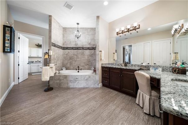 Bathroom, Dual Sink Vanities, Interior, Pendant Lights, Recessed Lighting, Wood Texture Flooring