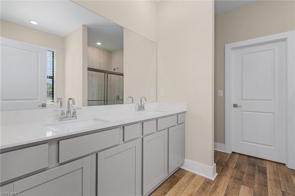 Bathroom, Dual Sink Vanities, Interior, Recessed Lighting, Wood Texture Flooring