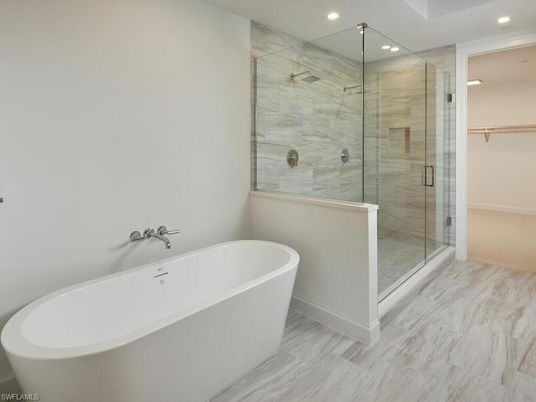 Bathroom, Free Standing Baths, Glass Shower, Interior, Marble, Marble Walls, Recessed Lighting