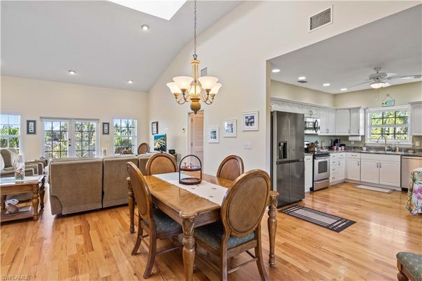 Chandelier, Dining room, Interior, Kitchen, Living room, Recessed Lighting, Stainless Steel Appliances, Wood Texture Flooring