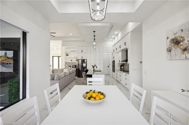 Dining room, Interior, Kitchen, Living room, Pendant Lights, Recessed Lighting, Stainless Steel Appliances, Wood Texture Flooring