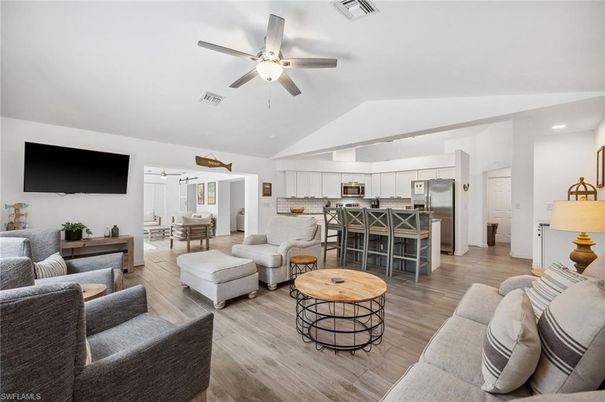 Dining room, Interior, Kitchen, Living room, Recessed Lighting, Stainless Steel Appliances, Wood Texture Flooring