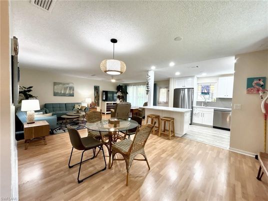 Dining room, Interior, Kitchen, Living room, Pendant Lights, Recessed Lighting, Stainless Steel Appliances, Wood Texture Flooring
