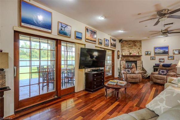 Fireplace, Interior, Living room, Recessed Lighting, Stone Walls, Wood Texture Flooring
