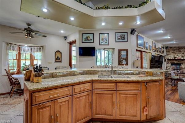 Fireplace, Interior, Living room, Recessed Lighting, Stone Walls, Wood Texture Flooring