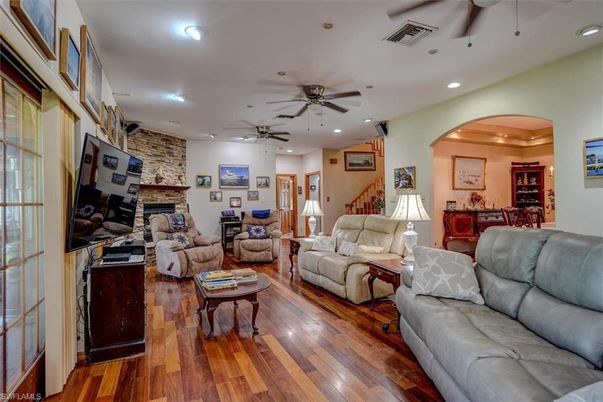 Fireplace, Interior, Living room, Recessed Lighting, Stone Walls, Wood Texture Flooring