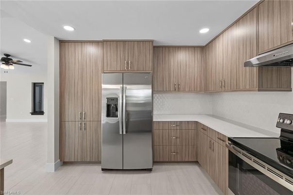 Interior, Kitchen, Recessed Lighting, Stainless Steel Appliances, Wood Texture Flooring