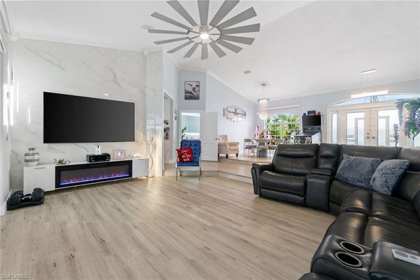 Dining room, Fireplace, Interior, Living room, Marble Walls, Pendant Lights, Wood Texture Flooring