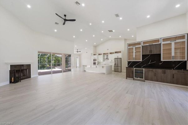Empty room, Fireplace, Interior, Kitchen, Recessed Lighting, Wood Texture Flooring