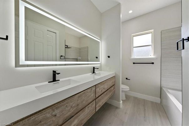 Bathroom, Dual Sink Vanities, Interior, Recessed Lighting, Wood Texture Flooring