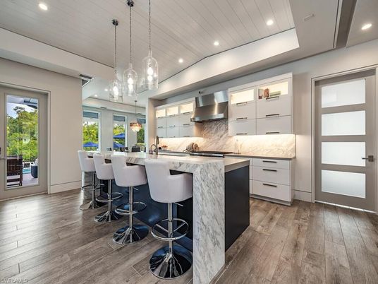 Interior, Kitchen, Marble Walls, Pendant Lights, Recessed Lighting, Stainless Steel Appliances, Wood Texture Flooring