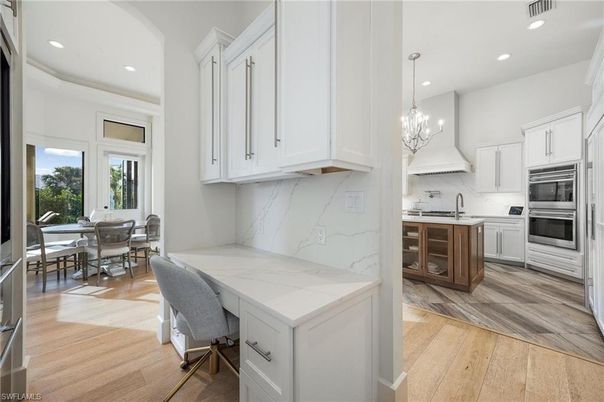 Chandelier, Dining room, Interior, Kitchen, Marble Walls, Recessed Lighting, Stainless Steel Appliances, Wood Texture Flooring