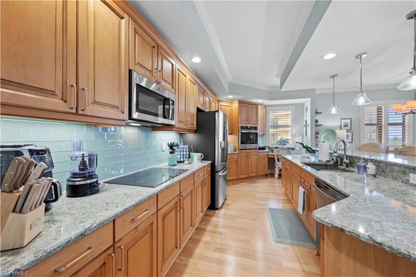 Dining room, Interior, Kitchen, Pendant Lights, Recessed Lighting, Stainless Steel Appliances, Wood Texture Flooring