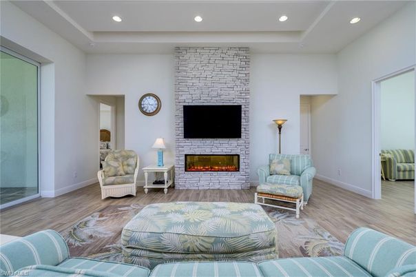 Fireplace, Interior, Living room, Recessed Lighting, Stone Walls, Wood Texture Flooring