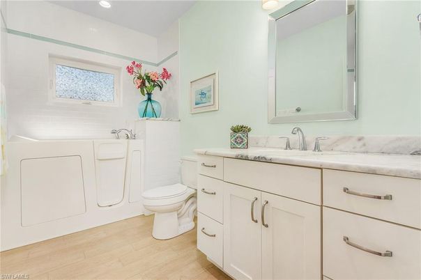 Bathroom, Dual Sink Vanities, Interior, Recessed Lighting, Wood Texture Flooring