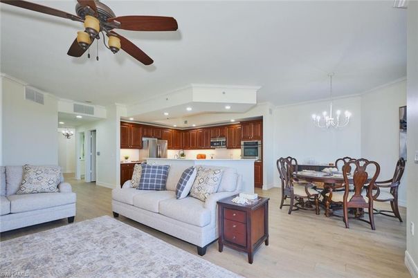 Chandelier, Dining room, Interior, Kitchen, Living room, Pendant Lights, Recessed Lighting, Stainless Steel Appliances, Wood Texture Flooring