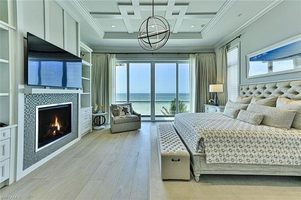 Bedroom, Fireplace, Interior, Pendant Lights, Recessed Lighting, Water, Wood Texture Flooring