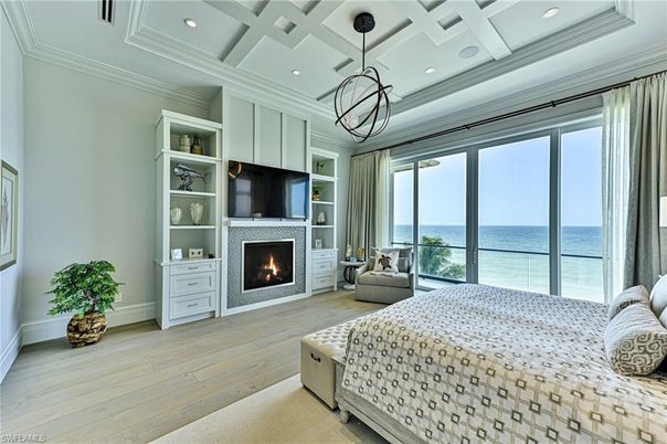 Bedroom, Fireplace, Interior, Pendant Lights, Recessed Lighting, Water, Wood Texture Flooring