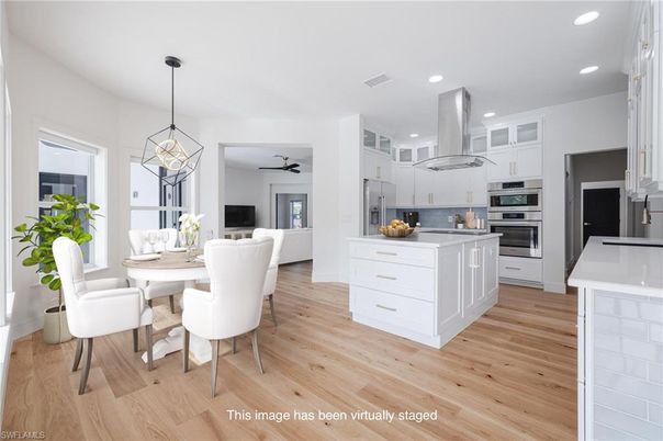 Dining room, Interior, Kitchen, Pendant Lights, Recessed Lighting, Stainless Steel Appliances, Wood Texture Flooring